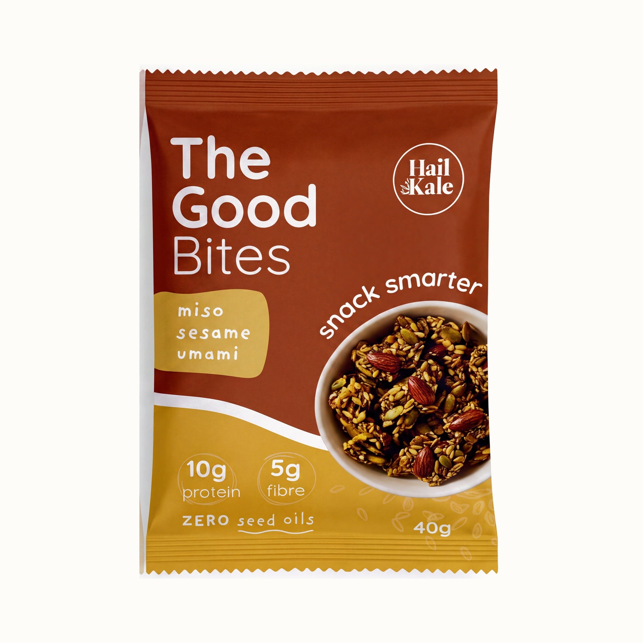 The Good Bites Miso Sesame Umami 40g pouch, deep red and gold pack with a bowl of sesame and almond seed clusters, 10g protein, 5g fibre, zero seed oils
