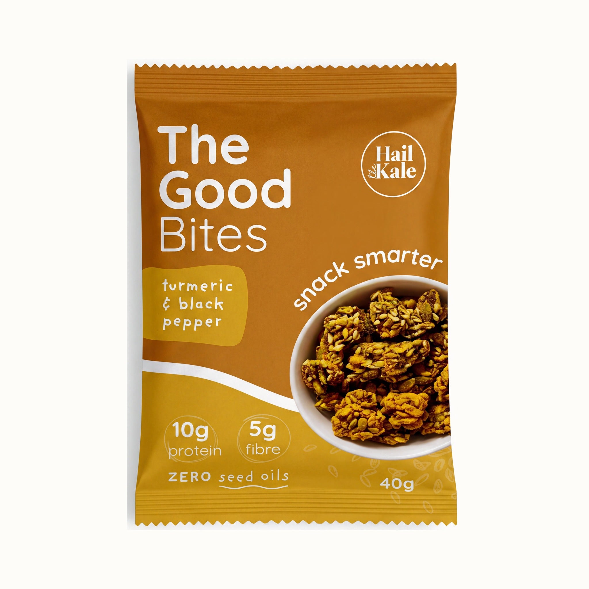 The Good Bites Turmeric and Black Pepper 40g pouch, amber pack with a bowl of golden seed clusters, 10g protein, 5g fibre, zero seed oils